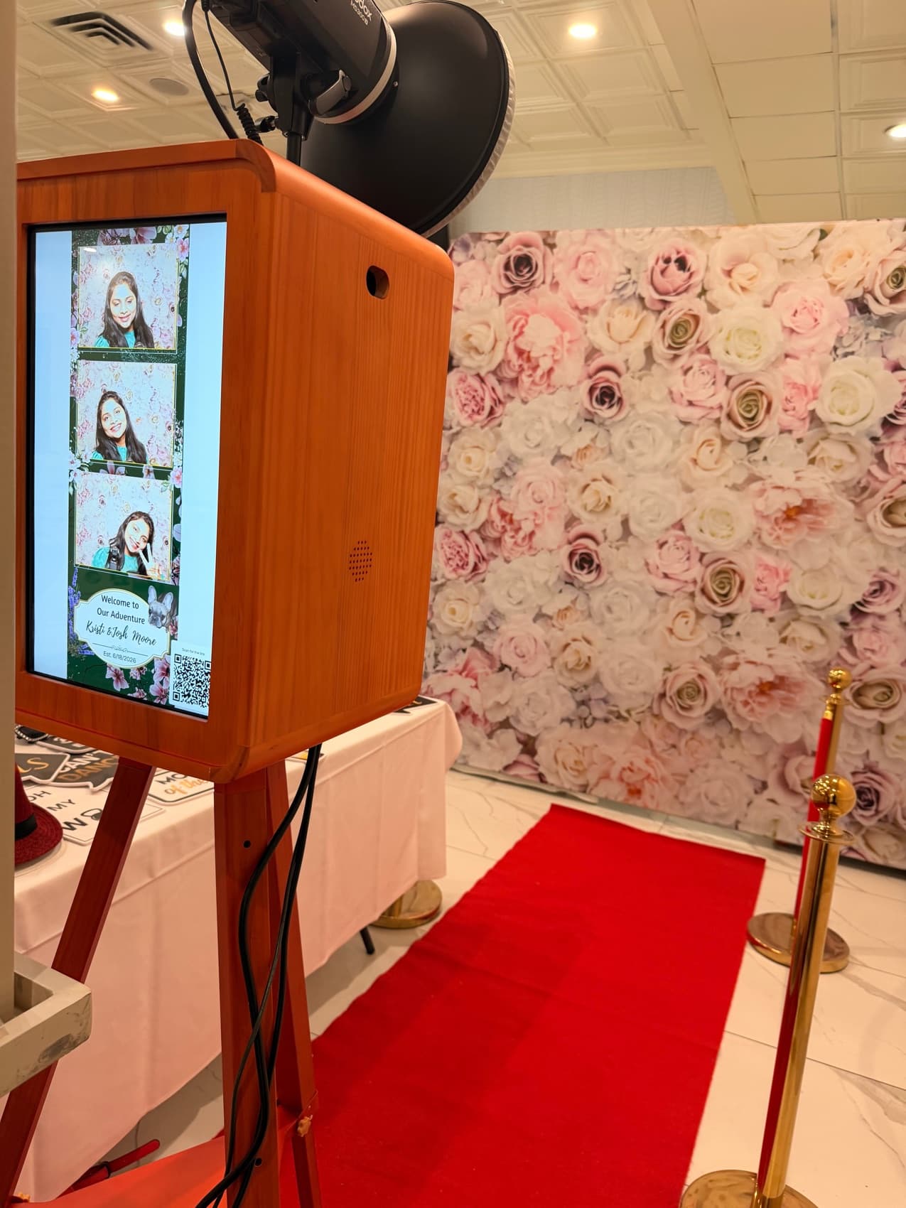 Guests posing at a Snap'N'Stick photo booth in Michigan