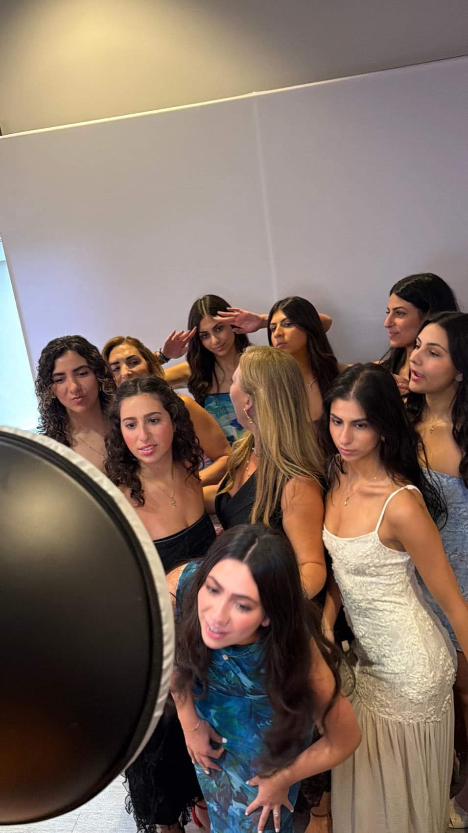 Guests posing at a Snap'N'Stick photo booth in Michigan