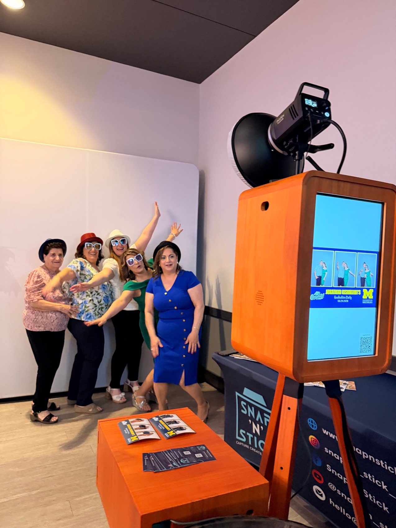 Guests posing with the Snap'N'Stick Vintage booth